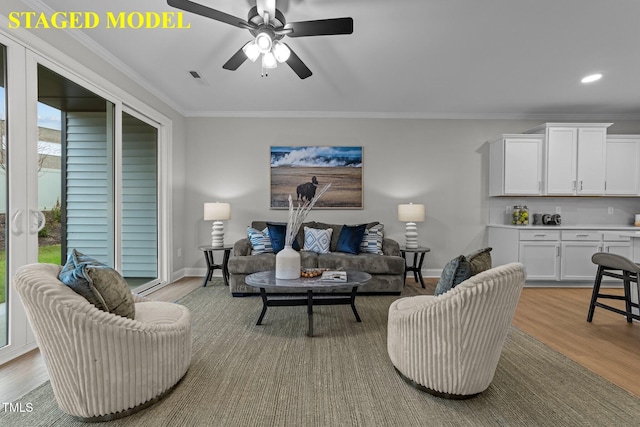 610 Marshskip Way, Rolesville, NC 27587 - living room featuring crown molding, light wood-style flooring, baseboards, ceiling fan, and recessed lighting