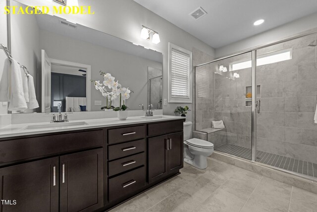 610 Marshskip Way, Rolesville, NC 27587 - full bath with double vanity, a stall shower, and toilet