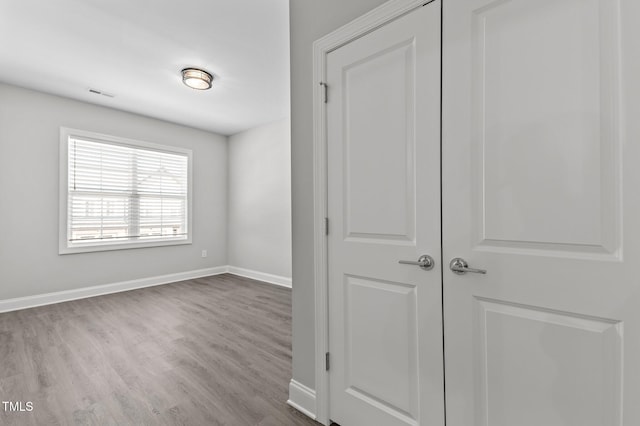 608 Marshskip Way, Rolesville, NC 27587 - spare room with wood finished floors and baseboards