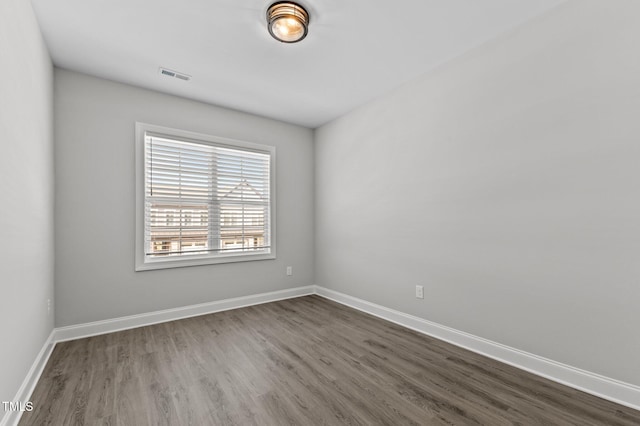 608 Marshskip Way, Rolesville, NC 27587 - spare room with dark wood-style flooring and baseboards