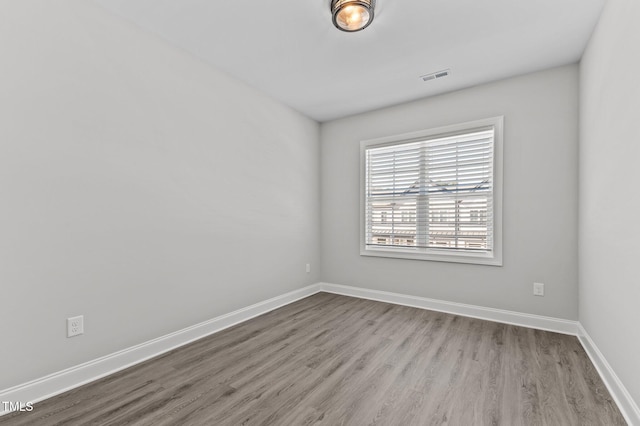 608 Marshskip Way, Rolesville, NC 27587 - spare room featuring wood finished floors and baseboards