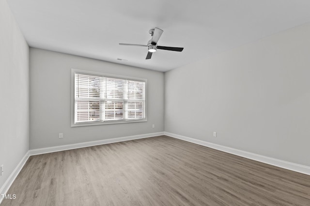 608 Marshskip Way, Rolesville, NC 27587 - spare room with wood finished floors, ceiling fan, and baseboards