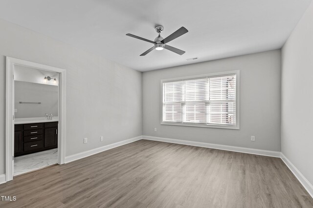 608 Marshskip Way, Rolesville, NC 27587 - unfurnished bedroom featuring wood finished floors, baseboards, connected bathroom, and a ceiling fan
