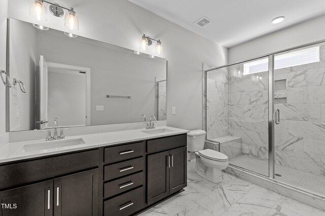 608 Marshskip Way, Rolesville, NC 27587 - full bathroom featuring marble finish floors, double vanity, toilet, and a marble finish shower