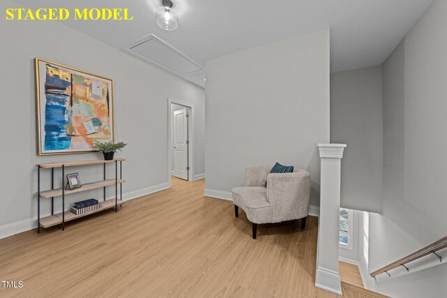 608 Marshskip Way, Rolesville, NC 27587 - sitting room featuring wood finished floors, attic access, baseboards, and an upstairs landing