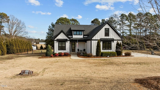 modern inspired farmhouse with a front yard