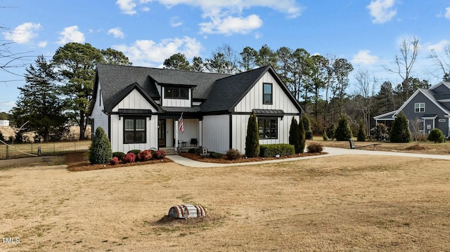 modern inspired farmhouse featuring a front yard