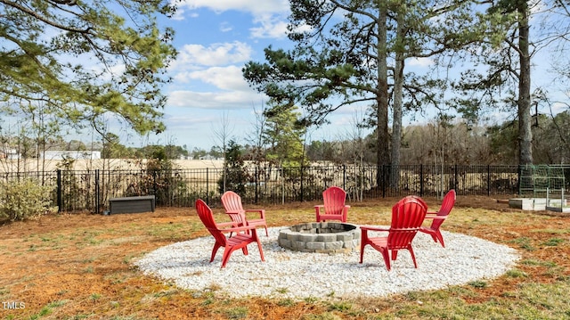 view of yard with a fire pit