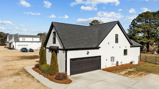 view of side of property featuring a garage