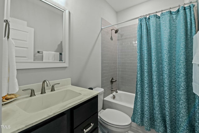 full bathroom featuring vanity, shower / tub combo with curtain, and toilet