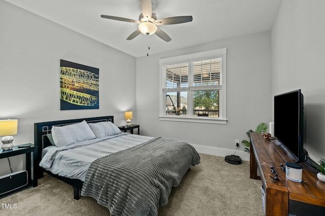 bedroom featuring ceiling fan and light colored carpet