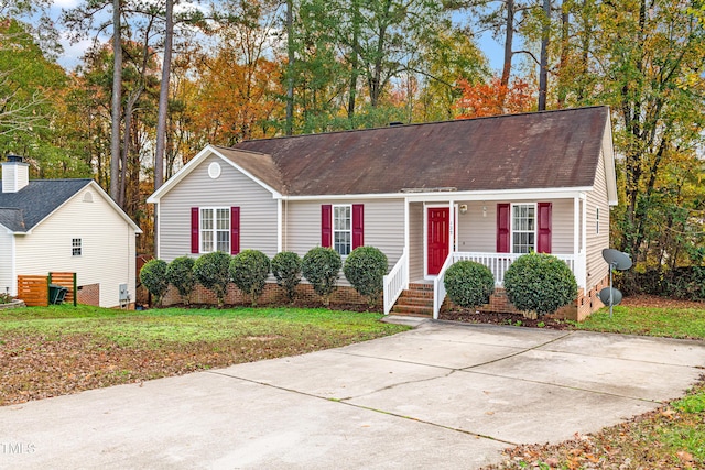 view of front of property with covered porch and a front lawn