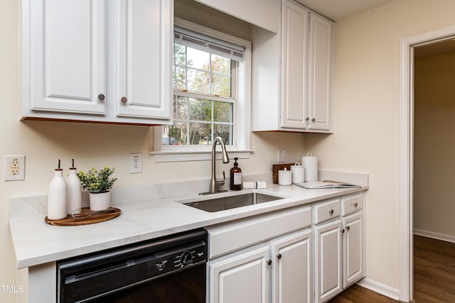 kitchen with white cabinetry, dishwasher, sink, and dark wood-type flooring