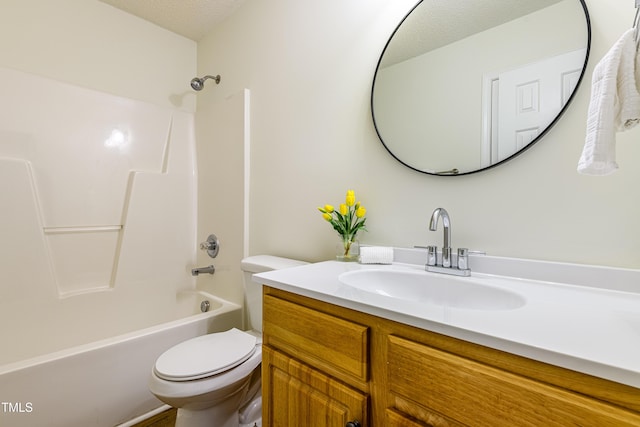 full bathroom with vanity, shower / bathing tub combination, toilet, and a textured ceiling