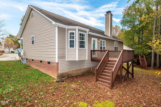 exterior space featuring a wooden deck