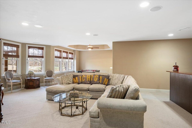 living room with light carpet and ceiling fan