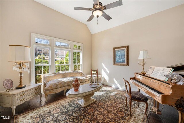living area featuring lofted ceiling and ceiling fan