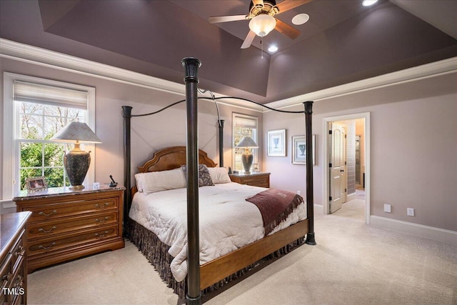 bedroom with ceiling fan, a tray ceiling, vaulted ceiling, and light carpet