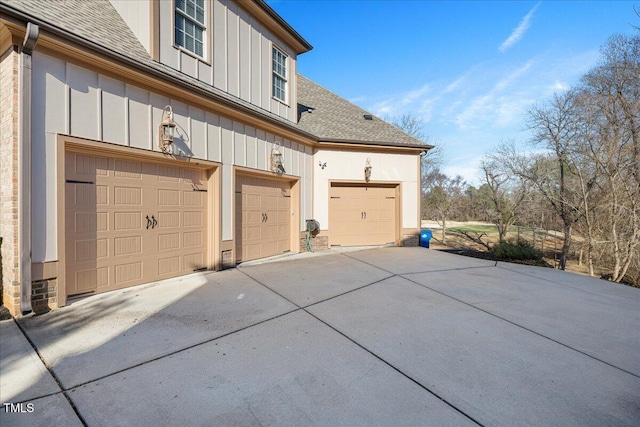 view of side of property with a garage