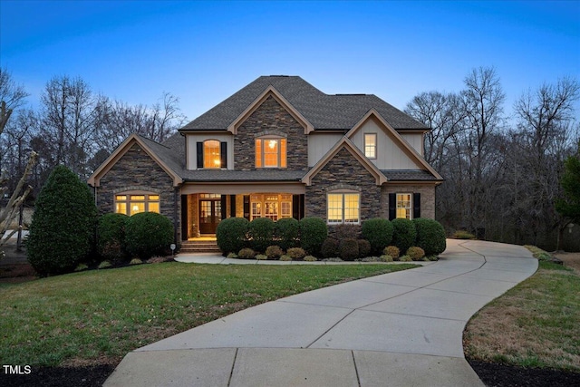 view of front of home with a lawn