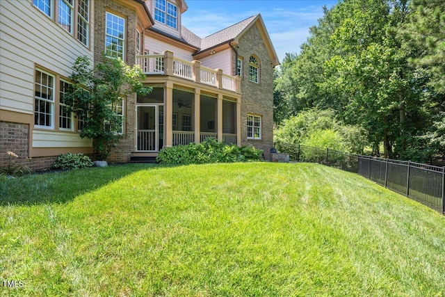 2933 Elmfield St, Raleigh, NC 27614 - view of yard with ceiling fan, a balcony, and a sunroom