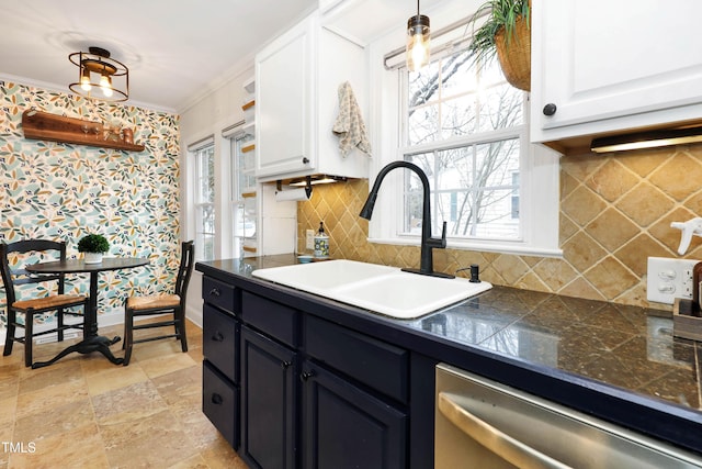 kitchen featuring white cabinetry, sink, hanging light fixtures, and dishwasher