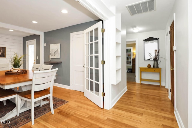 dining space with light hardwood / wood-style floors