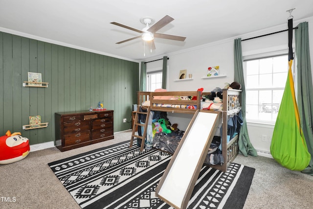 bedroom with multiple windows, light colored carpet, ornamental molding, and ceiling fan