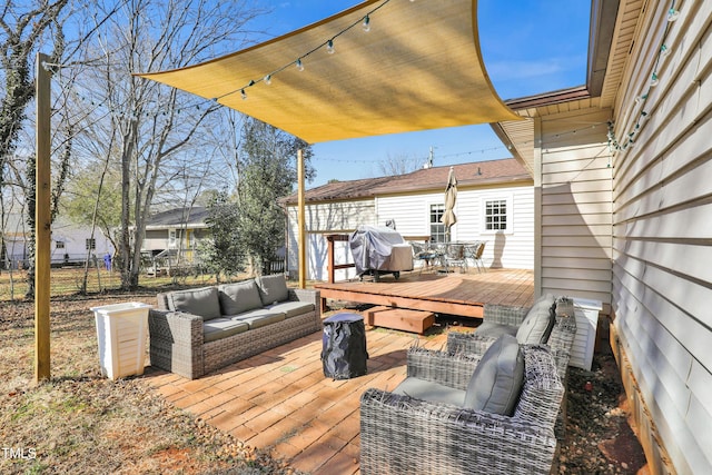 wooden deck featuring area for grilling and an outdoor hangout area