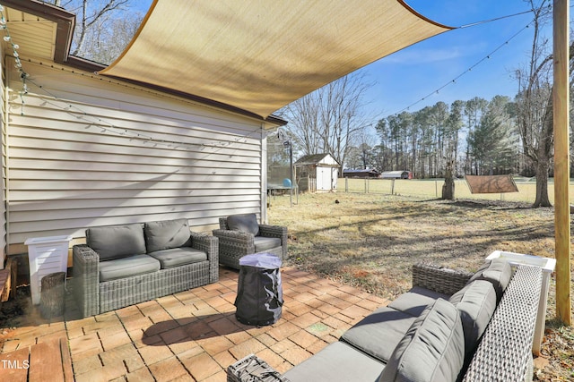 deck featuring a storage unit, an outdoor hangout area, and a patio