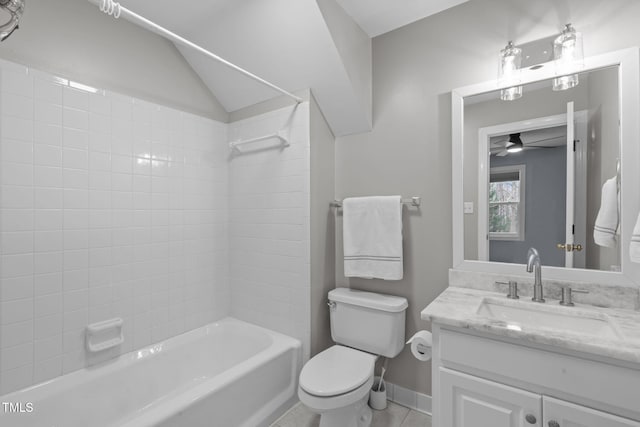 full bathroom with tiled shower / bath combo, vanity, tile patterned floors, and toilet