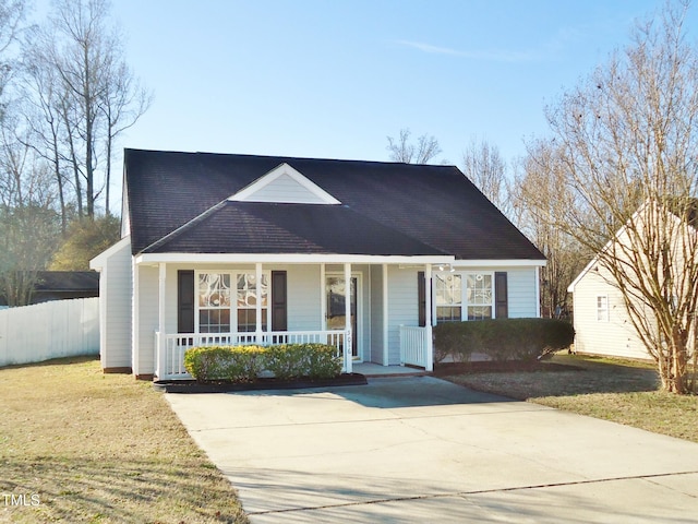 view of front of home featuring covered porch and a front yard