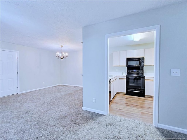 kitchen with dishwasher, white cabinetry, hanging light fixtures, electric range, and light colored carpet