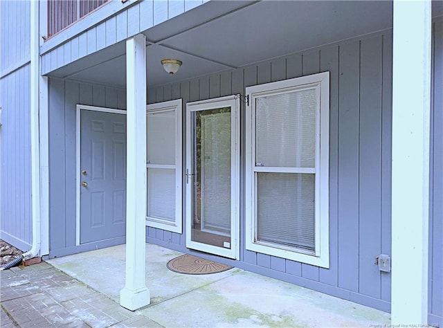 entrance to property featuring a patio