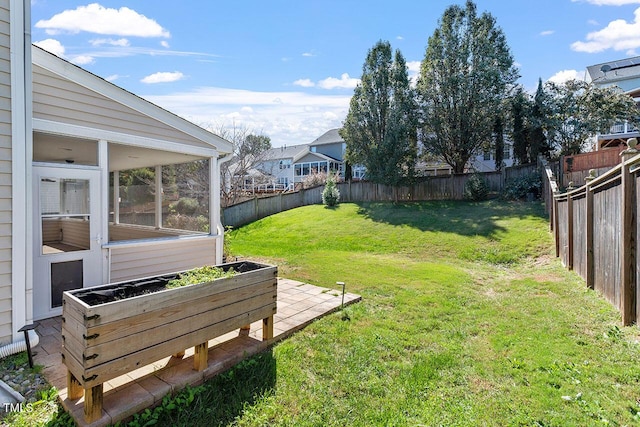 view of yard featuring a sunroom