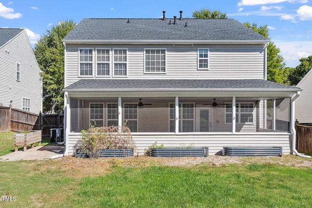 back of house with central AC unit, a lawn, a sunroom, and ceiling fan