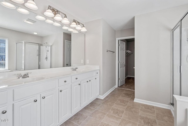 bathroom featuring vanity and an enclosed shower