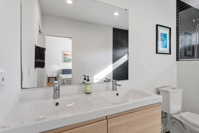 bathroom with vanity and toilet