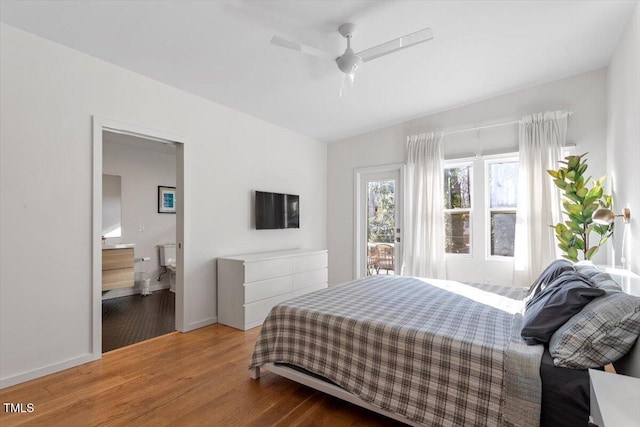 bedroom featuring ceiling fan, wood-type flooring, and ensuite bath