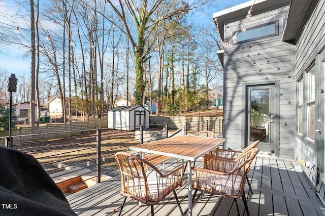 wooden deck featuring a storage shed