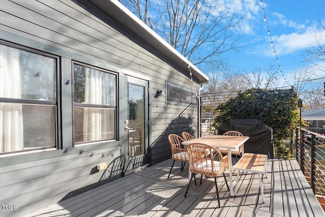 wooden deck featuring grilling area