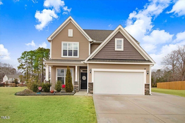 craftsman-style house featuring a garage and a front yard