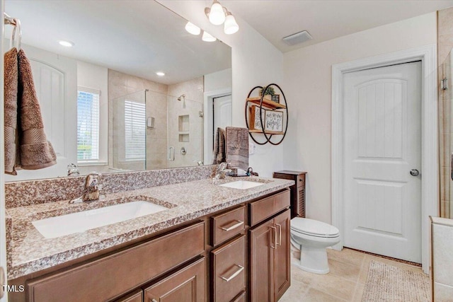 bathroom with vanity, tile patterned flooring, a shower with door, and toilet