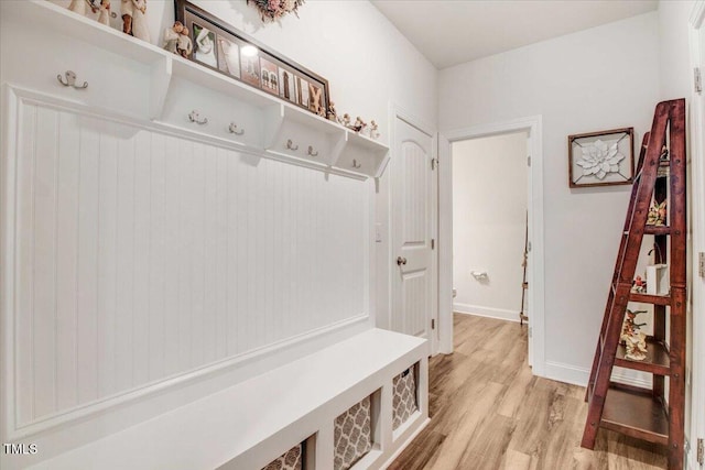 mudroom with light hardwood / wood-style floors