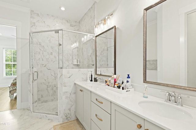 bathroom with vanity and a shower with shower door