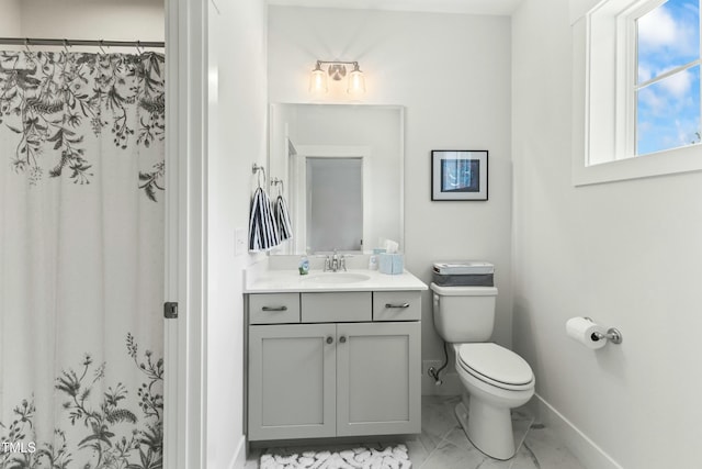 bathroom with vanity, a shower with curtain, and toilet