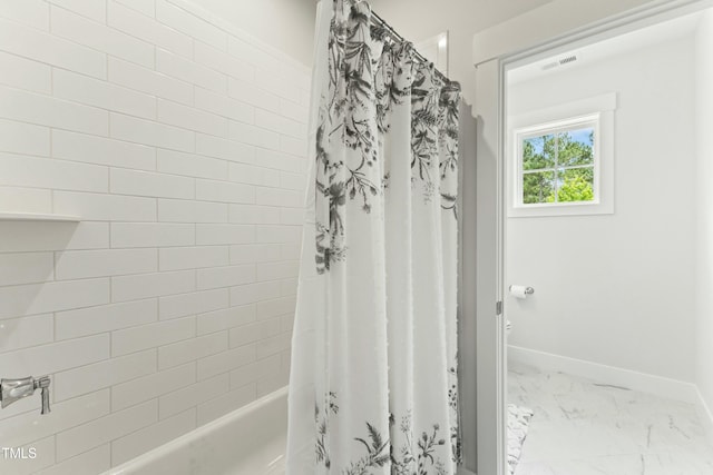 bathroom featuring shower / bathtub combination with curtain