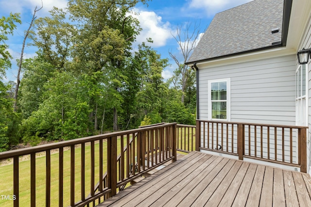 wooden deck with a yard