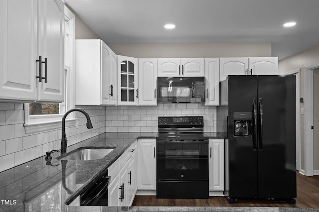 kitchen with white cabinets, sink, and black appliances