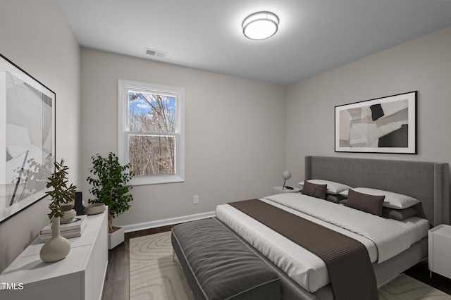 bedroom featuring dark hardwood / wood-style floors